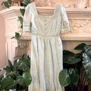 Bridgerton style powder blue summer gown with detailed lace embroidery